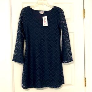 Navy blue knit dress with lining. Bell sleeves. Size M. 100% Polyester.